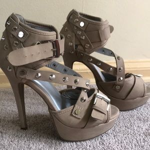 Buckled and spiked high heels